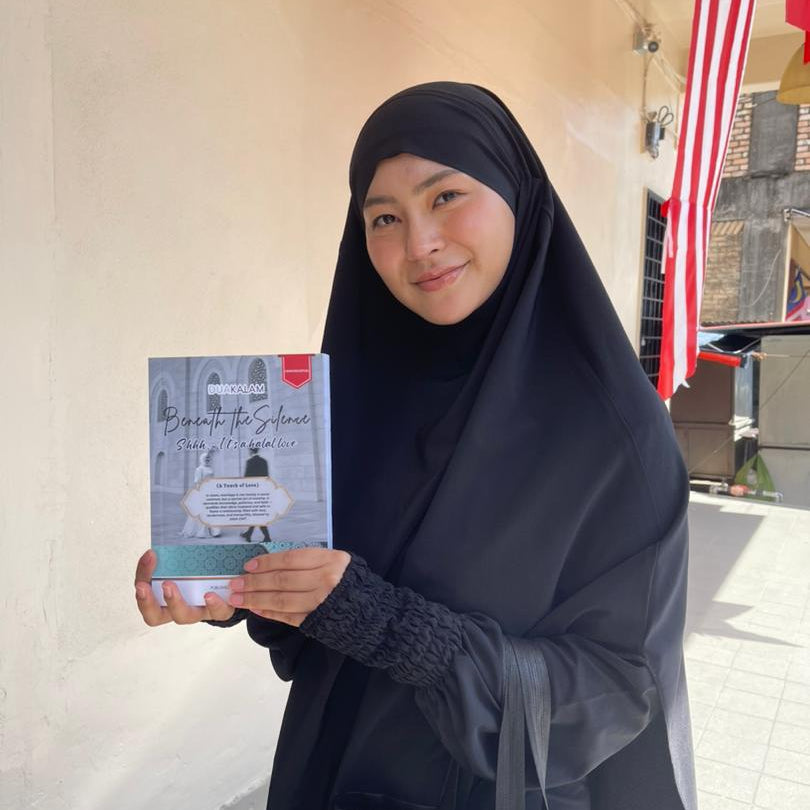 Woman holding a book titled